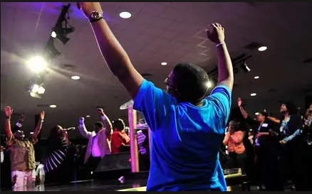 Believer with hands raised in worship